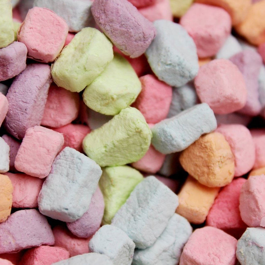 Close-up of colorful pastel cereal marshmallows in pink, yellow, purple, orange and blue