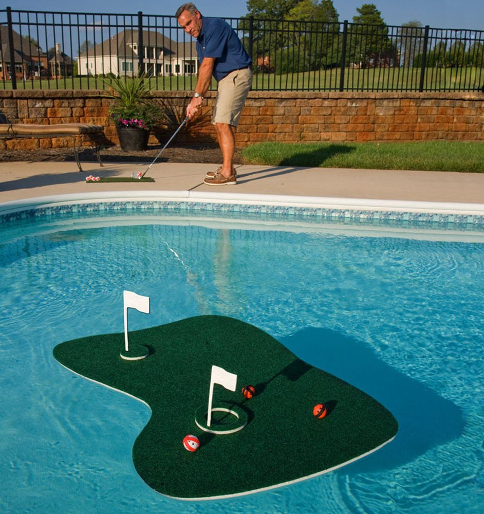 Floating golf putting green with flags positioned in a swimming pool