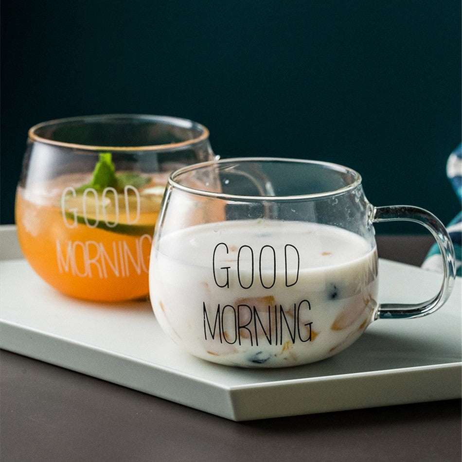 Two glass mugs with the words good morning written on the outside