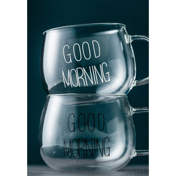 Two glass mugs stacked on top of each other with good morning written on each mug