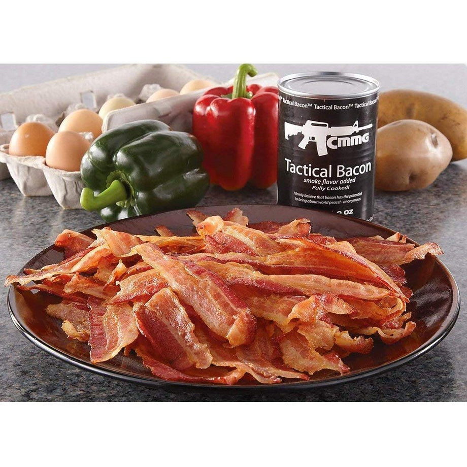 Can of Tactical Bacon beside cooked bacon strips, eggs, potatoes and bell peppers