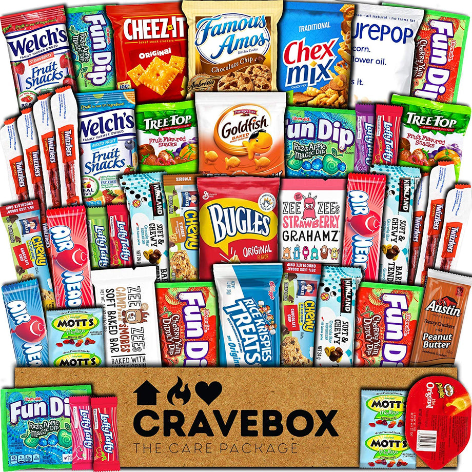 Large variety snack gift box overflowing with individually packaged chips, cookies, crackers, candy and fruit snacks