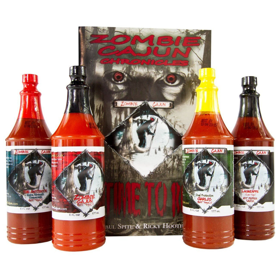Four bottles of Zombie Cajun hot sauce displayed beside horror-themed packaging