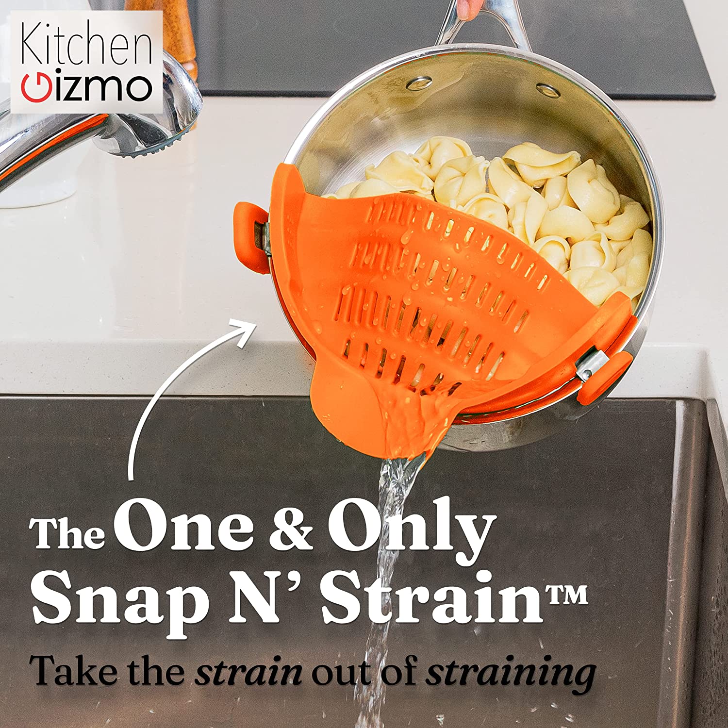 An orange silicone pot strainer is attached to a saucepan full of cooked pasta draining out the water. The text says, 'The one and only Snap N' Strain, take the strain out of straining.'