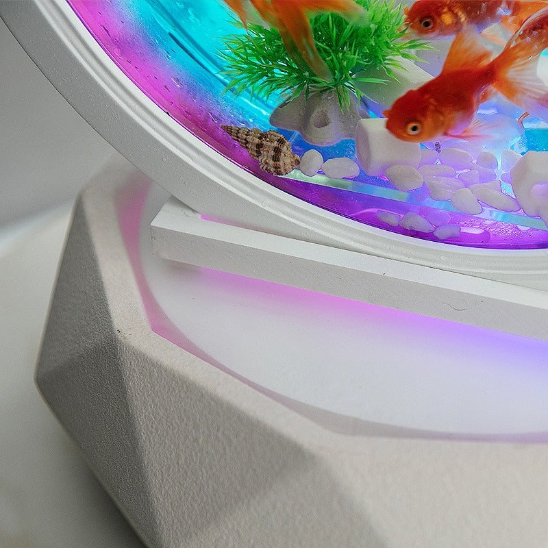 A close-up view of the air purifier on a waterfall aquarium air purifier. The base is white and has a faint purple glow. Clean air which has been purified appears to be coming out of the base. Part of the aquarium can be seen long with a few goldfish.