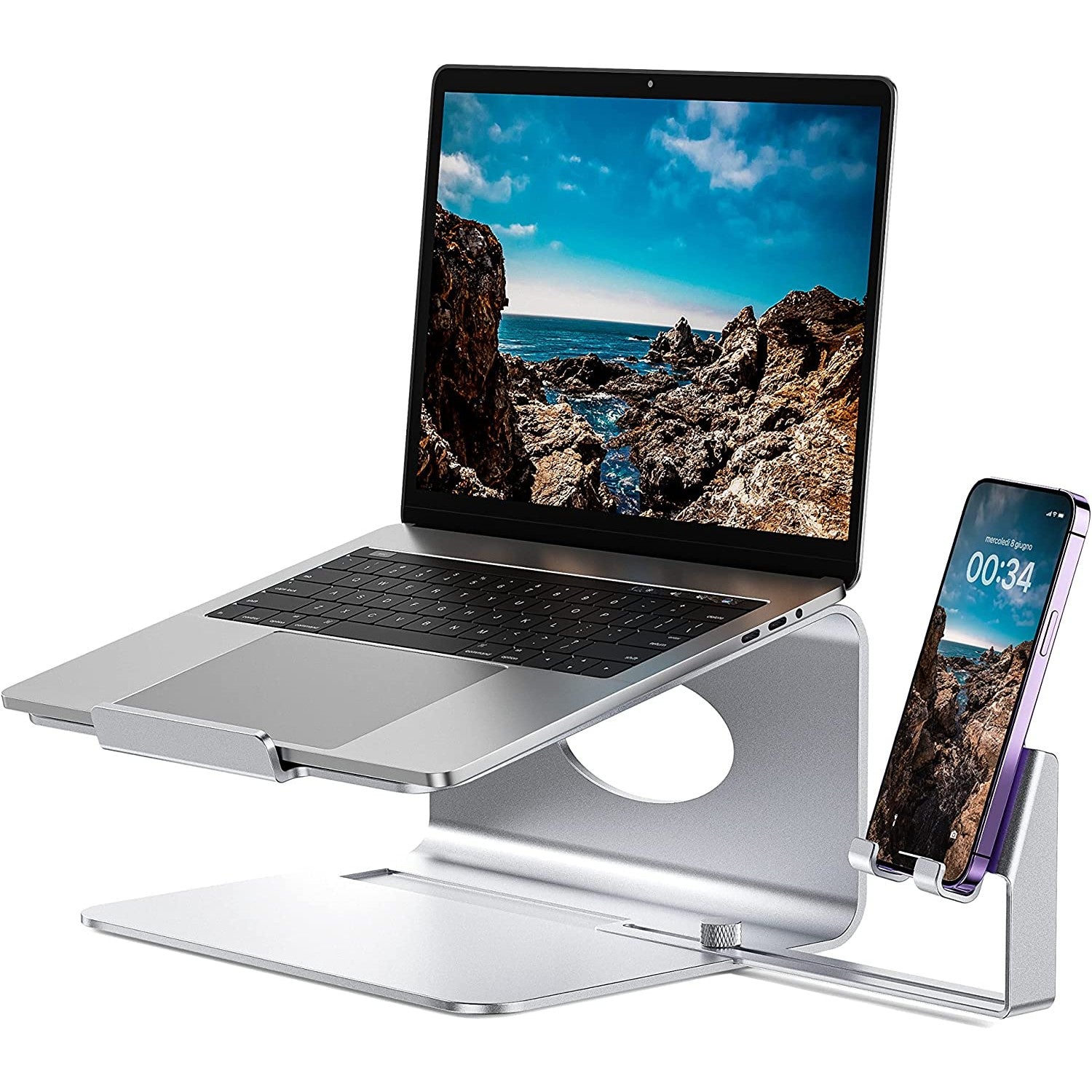 A metal laptop stand and phone holder which shows an open laptop on the stand and a cell phone in the holder.