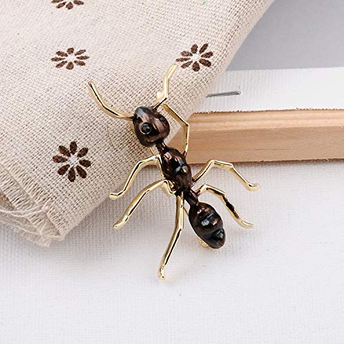 Ant brooch displayed as if its crawling up fabric