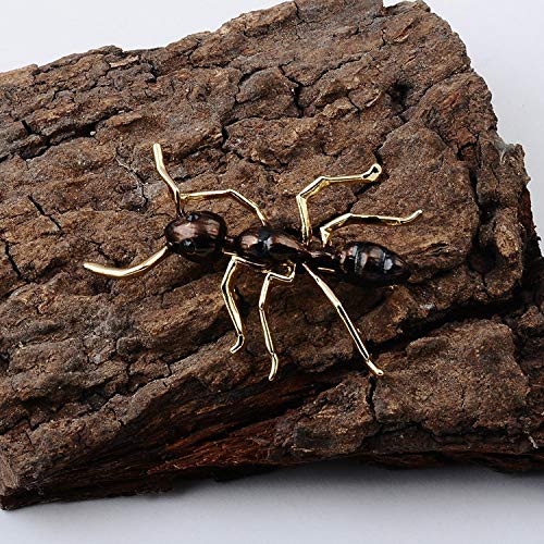 Gold and brown ant crawling along a log