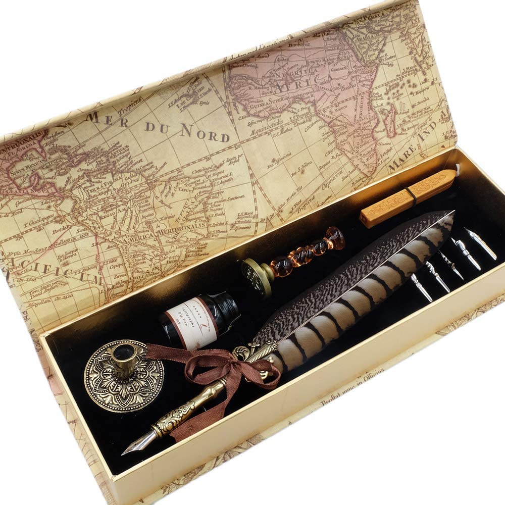 A boxed up antique pen quill set. Inside the box is a feather quill dip pen, a bottle with black ink, a pen holder, five nibs, one seal stamp and wax