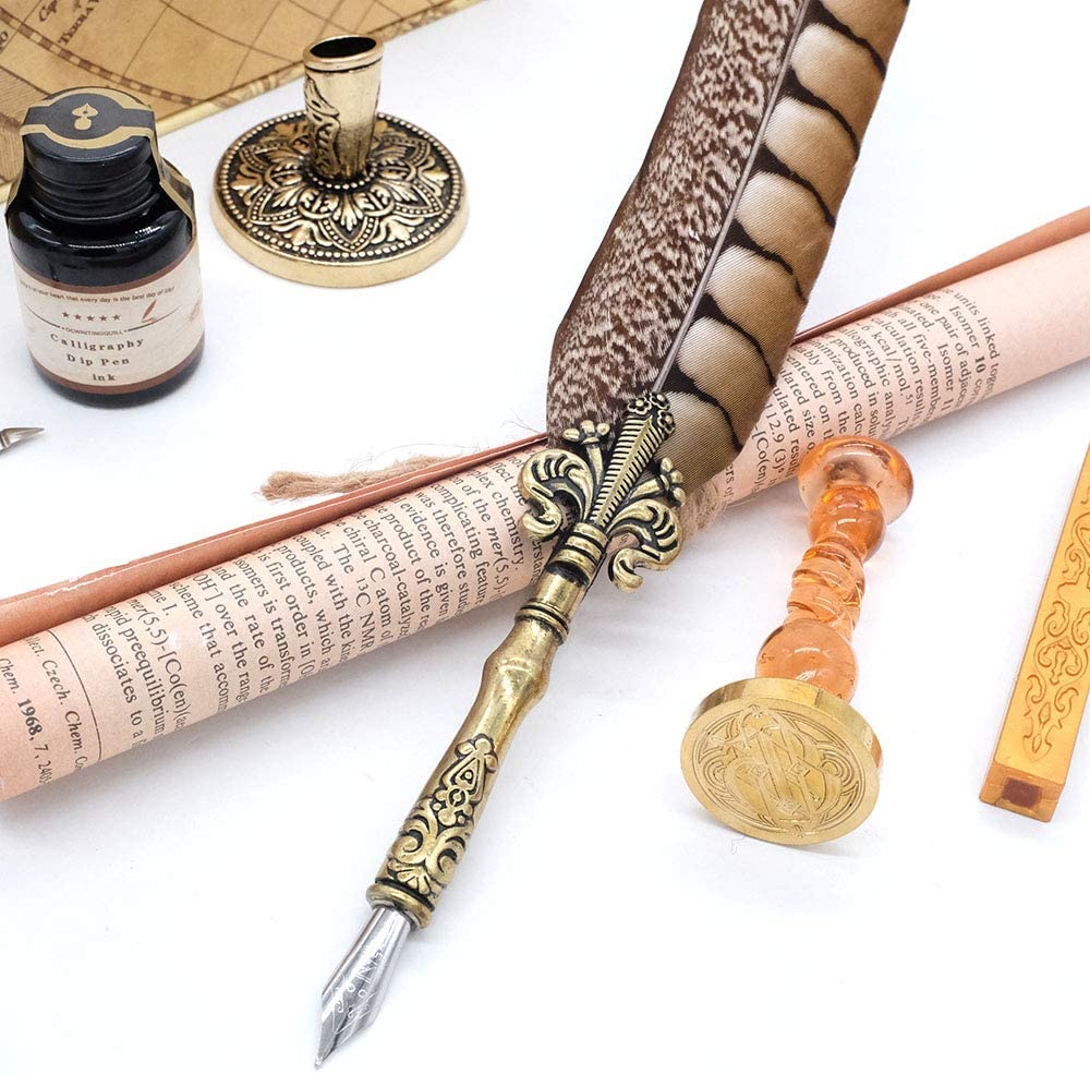 A close up view of the feather and pen nib that comes with the antique quill pen set.
