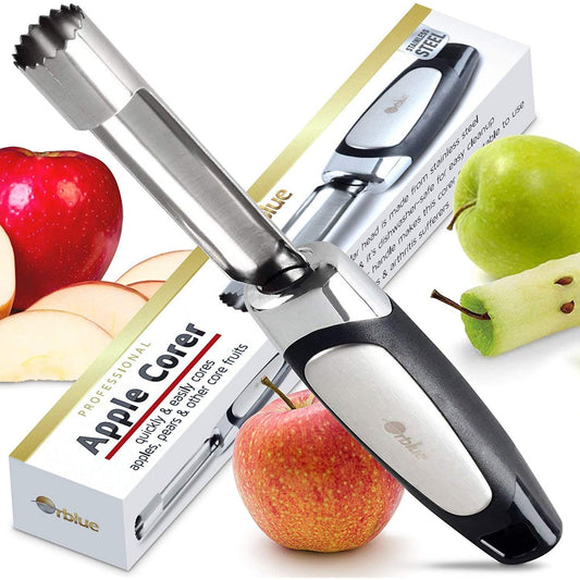 A stainless steel apple corer with a cored apple nearby. There are also two red apples nearby. The box for the corer can also be seen.