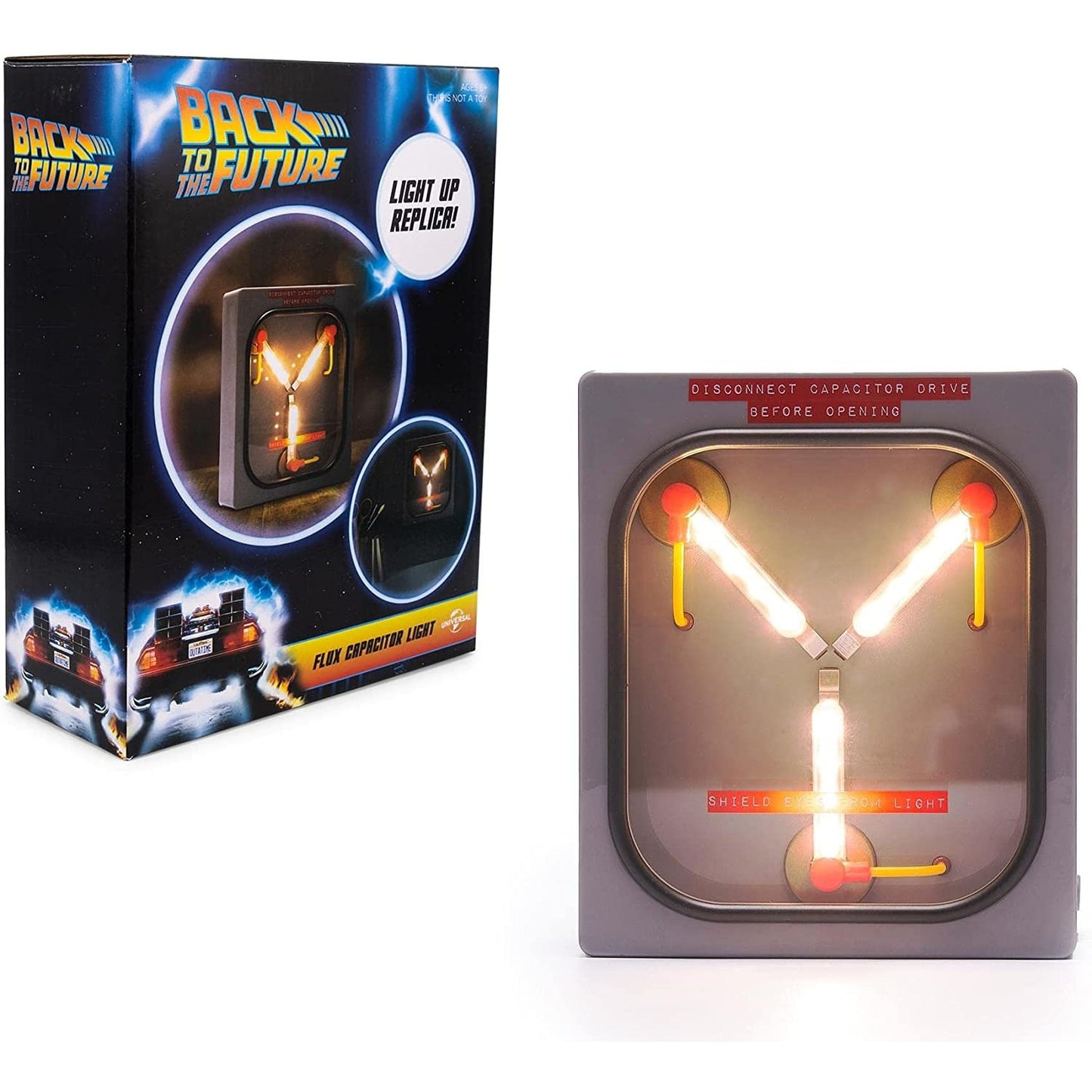 A Back to the Future Flux Capacitor replica mood light with its packaging box.