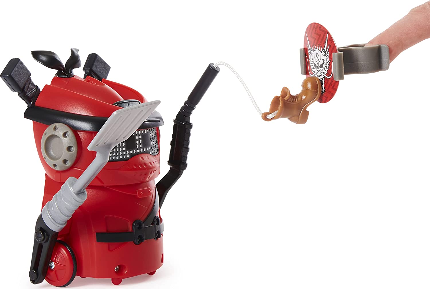 A red Ninja Bots holding a spatula and a shoe on a string aiming for a target.