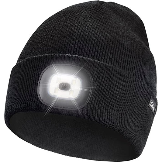 A black colored beanie with an inbuilt light at the front. The light is on.