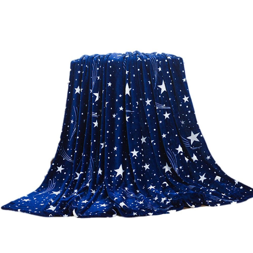 A large royal blue fleece blanket covered in different sized white stars.