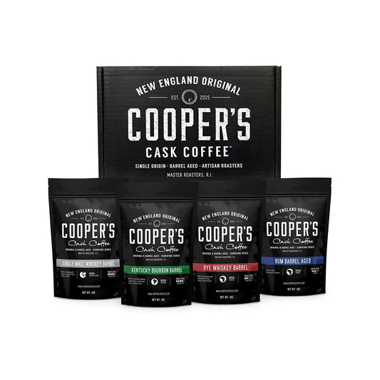 4 packets of different bourbon and whiskey barrel aged coffee bean bags by Coopers Cask Coffee.