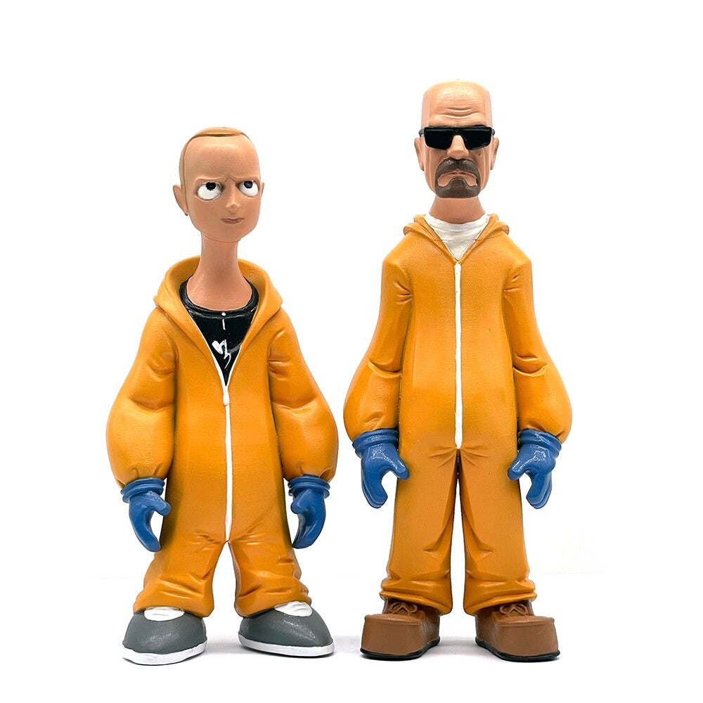 Two plastic figurines of the characters Walter and Jesse from the TV series Breaking Bad on a white background with the figures facing forward.