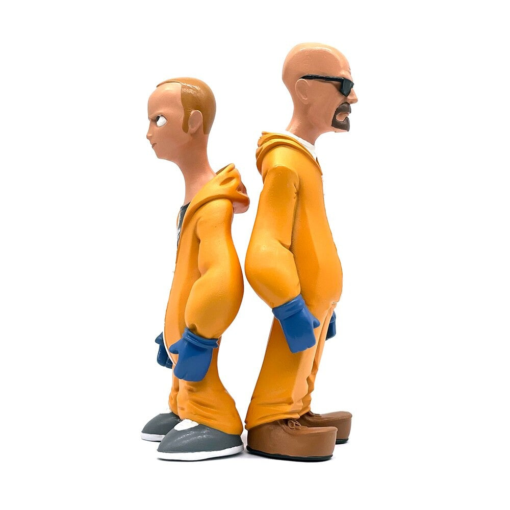 Breaking Bad Walter and Jesse figurines wearing their trademark orange hazmat suits. The figurines are back to back with each other showing a full length profile view.