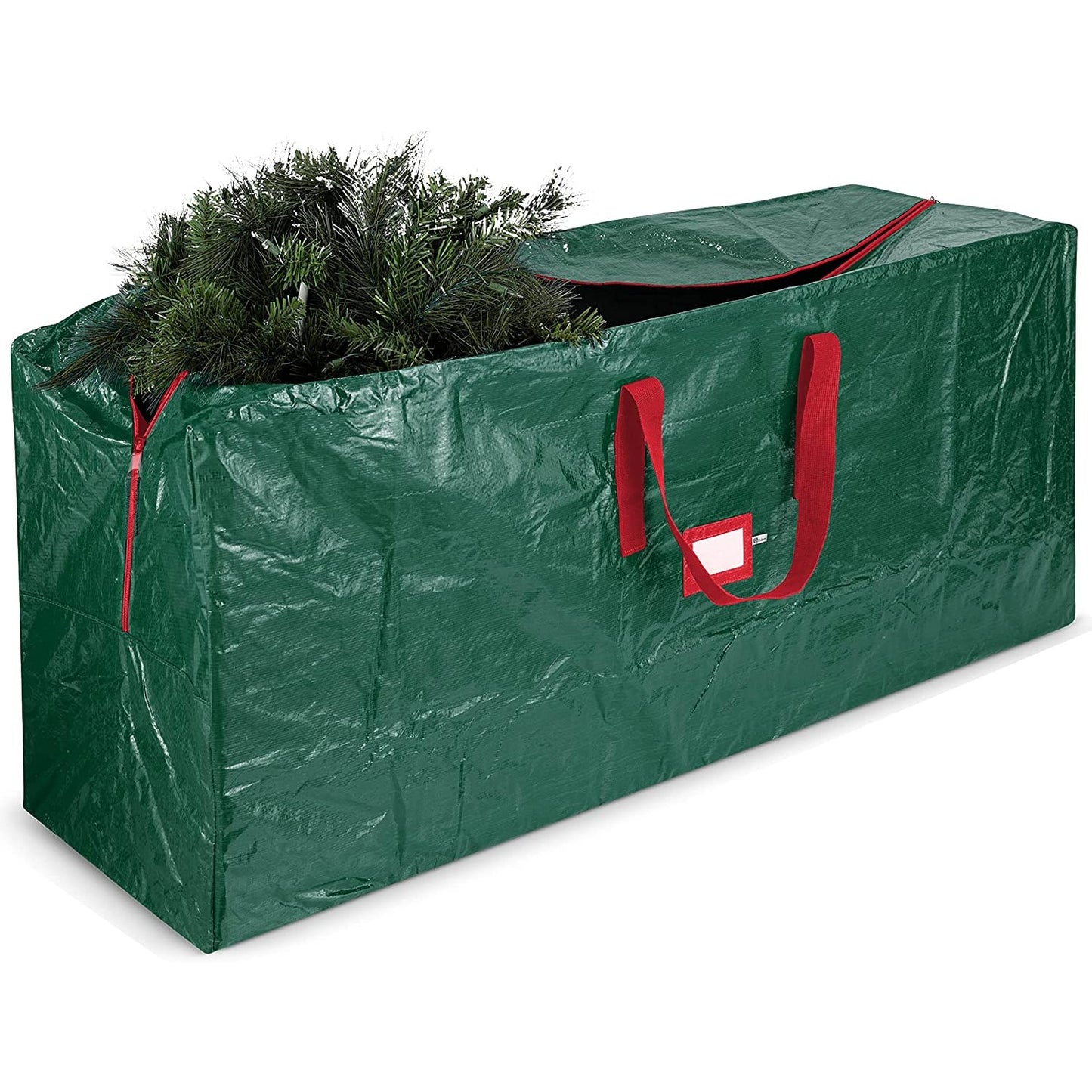 A large green Christmas tree storage bag with a Christmas tree inside.