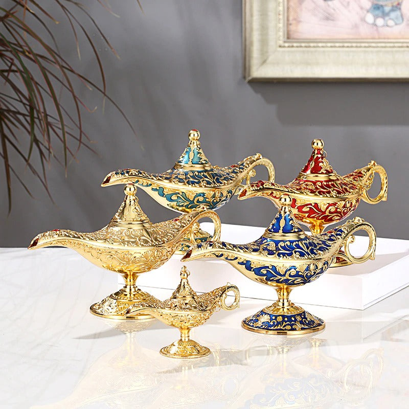 Five Aladdin classic magic genie lamps colored red, green, blue plus two gold lamps one large and one small size.