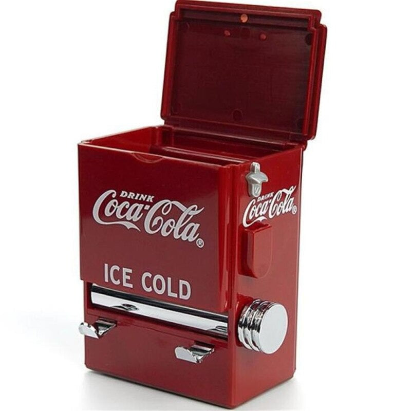 An old school Coca Cola toothpick dispenser which looks like a mini retro Coca Cola fridge.