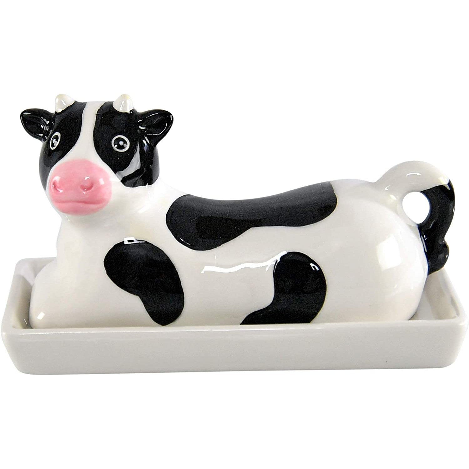 A black and white butter dish shaped like a cow.