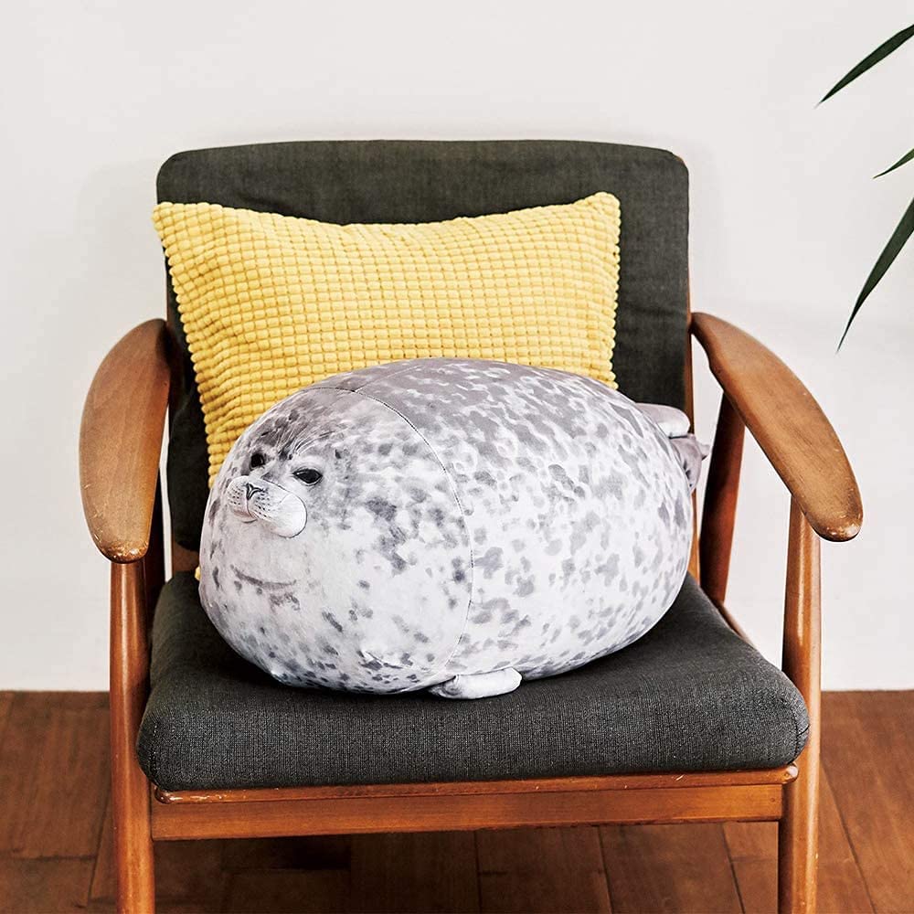 A seal pillow on a chair with another cushion
