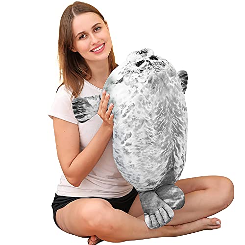 Woman against a white background holding up a seal pillow