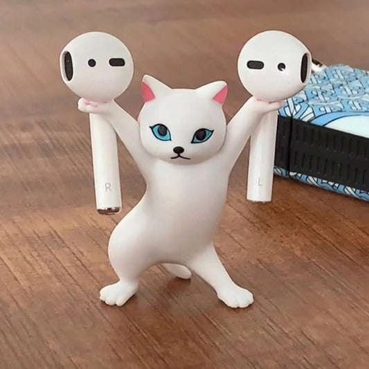 A figurine of a cat which looks like it is dancing and can be used to hold different objects. This cat is holding AirPods.