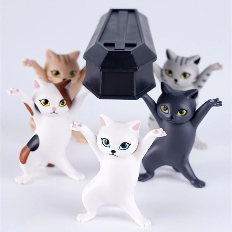 Five dancing cat figures holding a small black box on a white background.