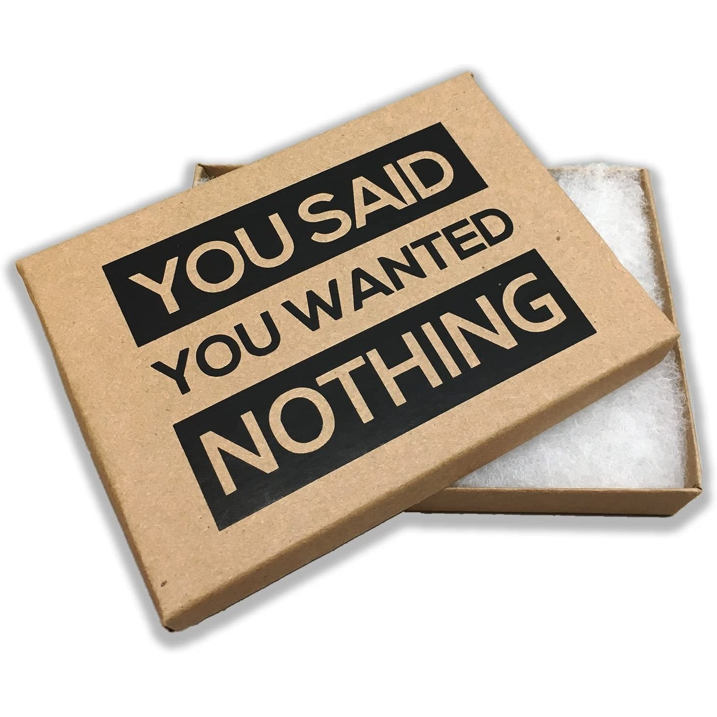An empty box with a lid. The lid has text all in caps which says, 'You Said You Wanted Nothing.' This is a gag gift idea for the person who always says they want nothing.
