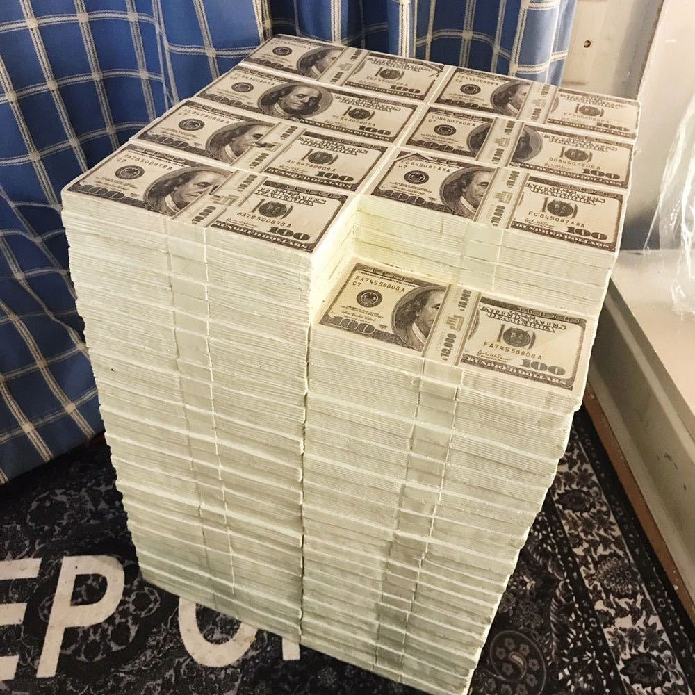A resin stool made up of bundles of faux American 100 dollar bills.