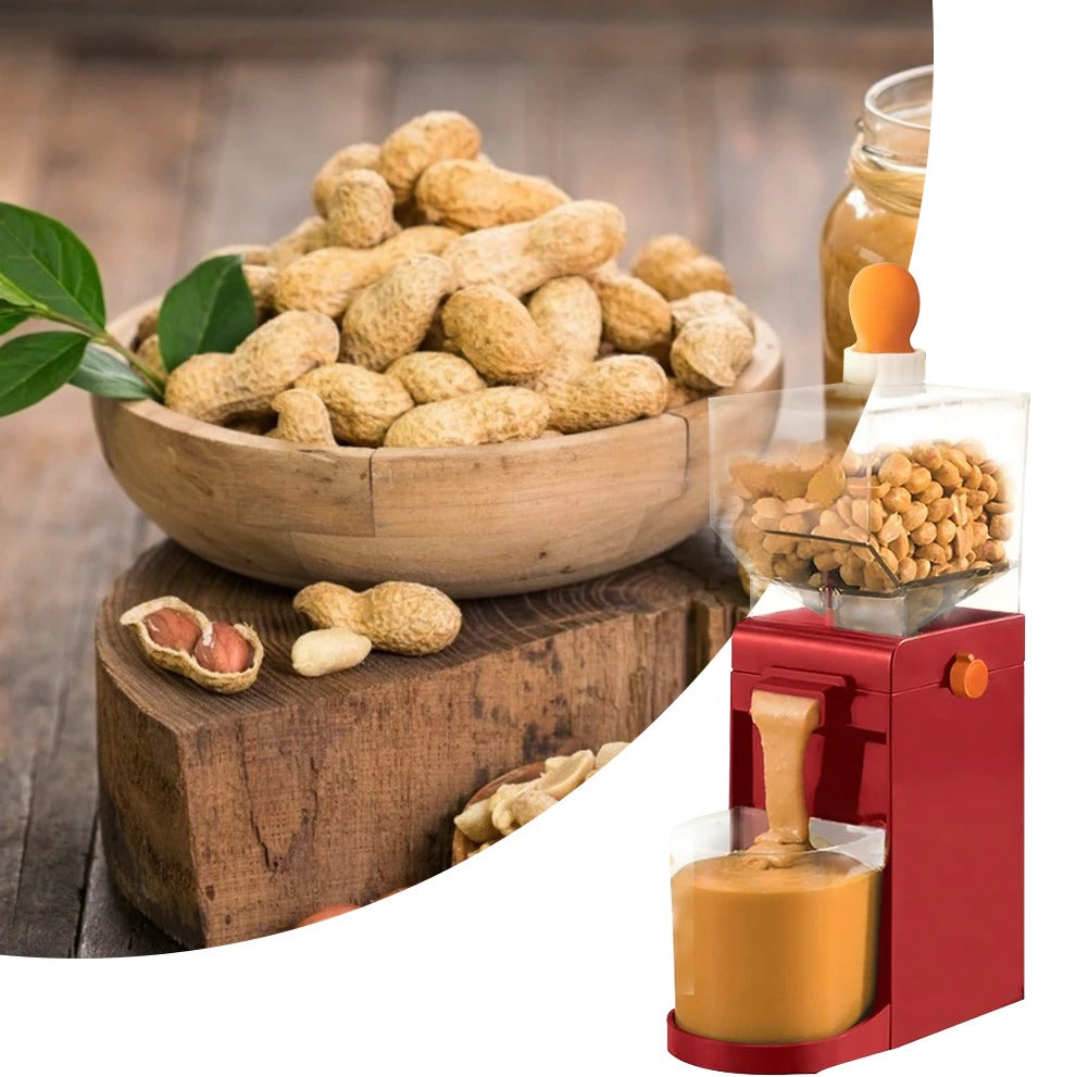 A red electric peanut butter machine with fresh peanut butter churning out of the machine into a jar. There is also a big bowl of unshelled peanuts.