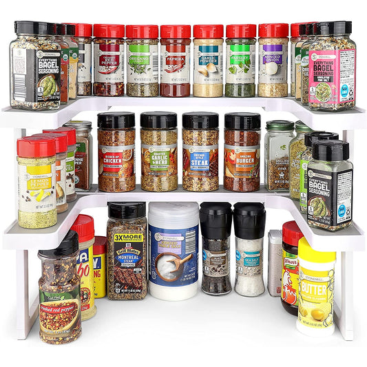 An expandable spice rack with various spices and condiments on the racks to show it in use.