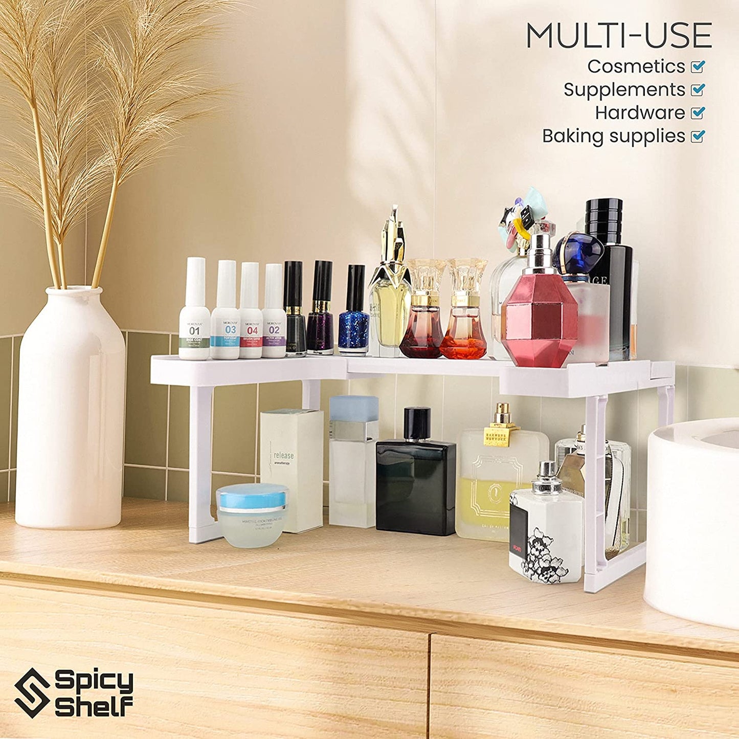 An expandable spice rack on a wooden counter. Instead of spices there are a number of beauty related items on the rack showing that it can used for more than just spices. The text reads, 'Multi-use. Cosmetics, supplements, hardware, baking supplies.'