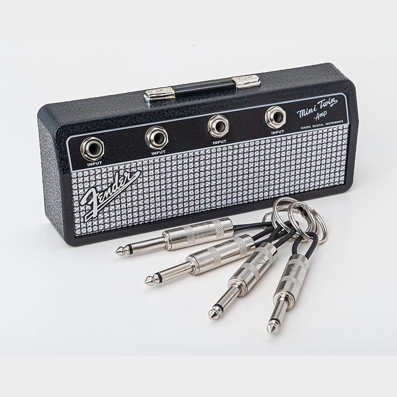 A Fender jack key rack with 4 laser etched Fender guitar plug keychains.