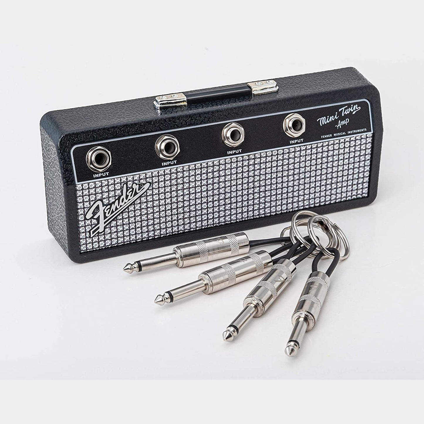 A Fender jack key rack with 4 laser etched Fender guitar plug keychains.