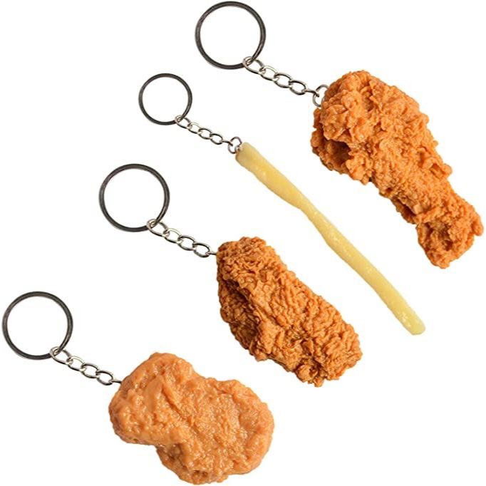 Four keychains which look like real french fries and chicken legs