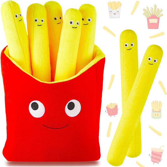 Yellow pillows shaped like French fries which all have smiley faces on them. The fries sit inside a red fry holder with a smiley face.