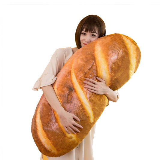 A woman hugging a giant pillow shaped as a loaf of bread
