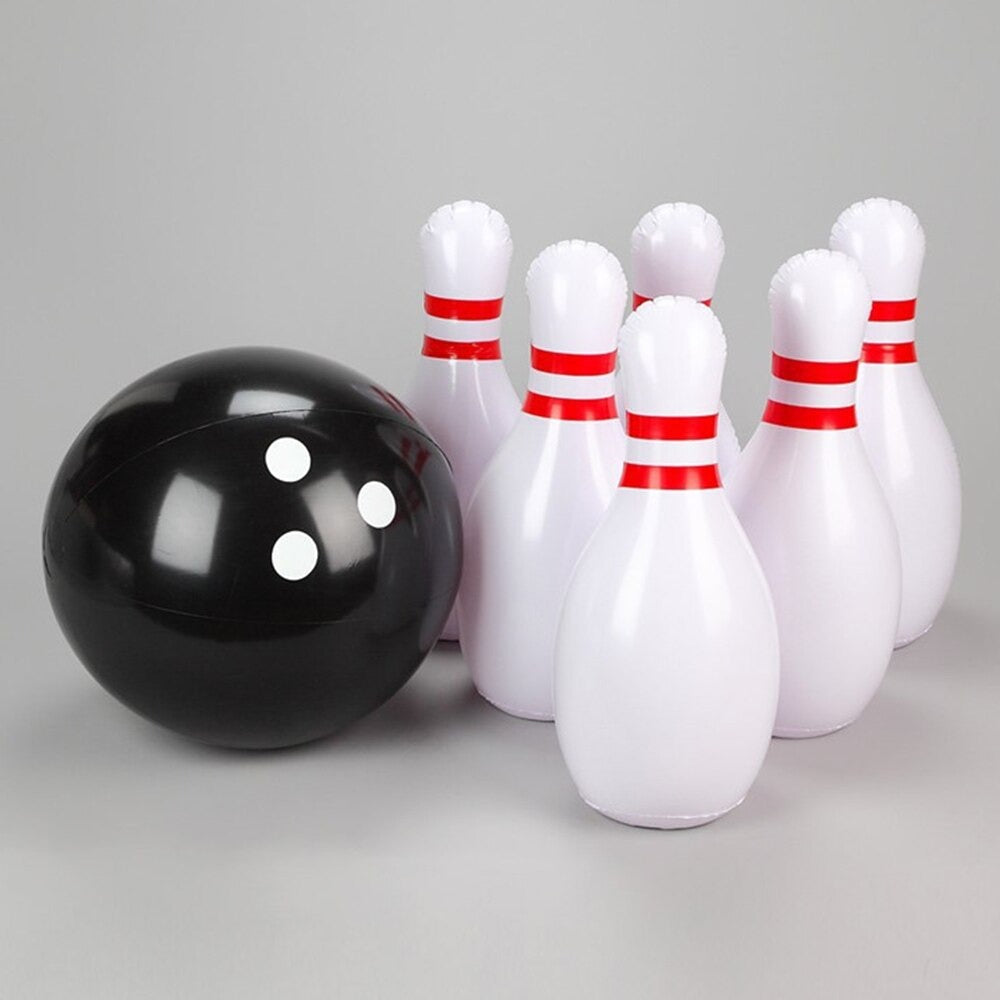 A giant inflatable outdoor bowling set which is setup on a grey background. It consists of six giant pins and an inflatable bowling ball.