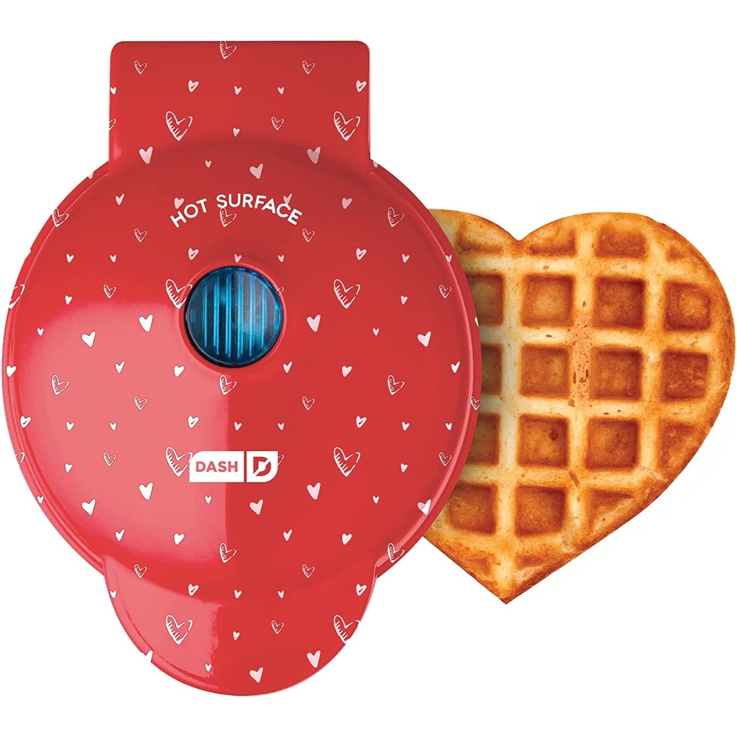 A red colored heart shaped waffle maker with a cooked heart shaped waffle next to the machine.