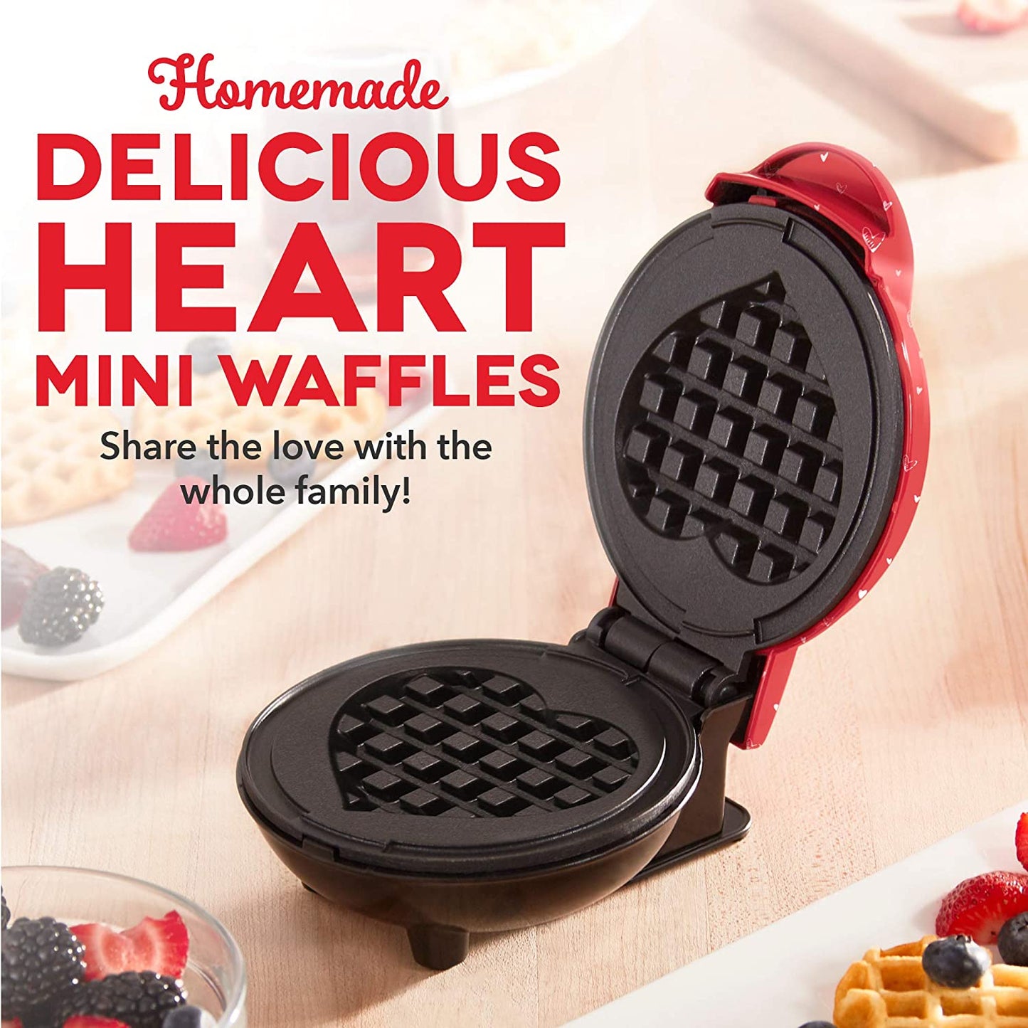 A heart shaped waffle maker machine with the lid open to show the heart shape inside. The headline reads, 'Homemade delicious heart mini waffles.'