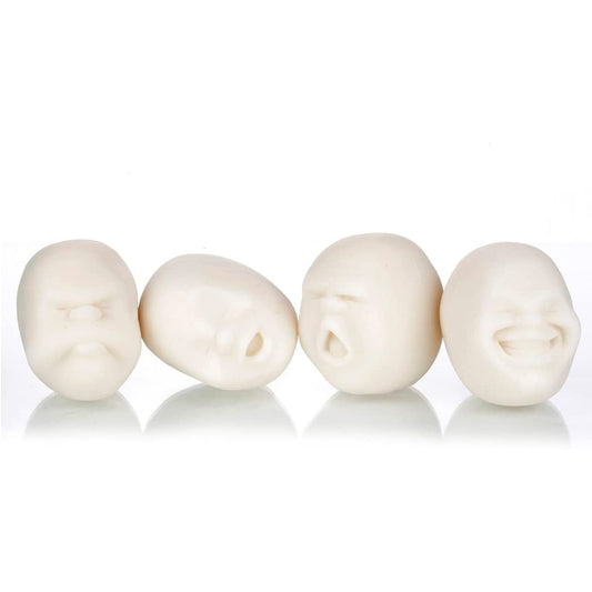 Four white anti-stress balls in the shape of human faces. Each face has a different expression.