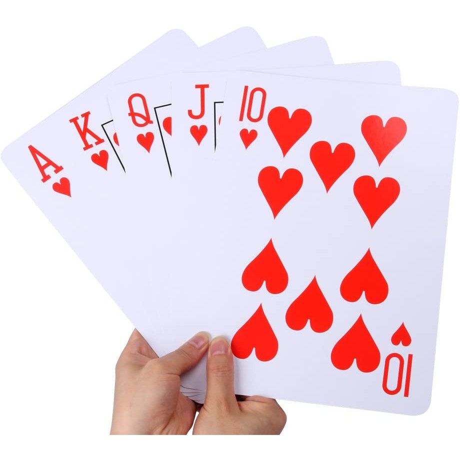Two hands holding 5 jumbo sized playing cards made up of an Ace, King, Queen, Jack and 10 of hearts.