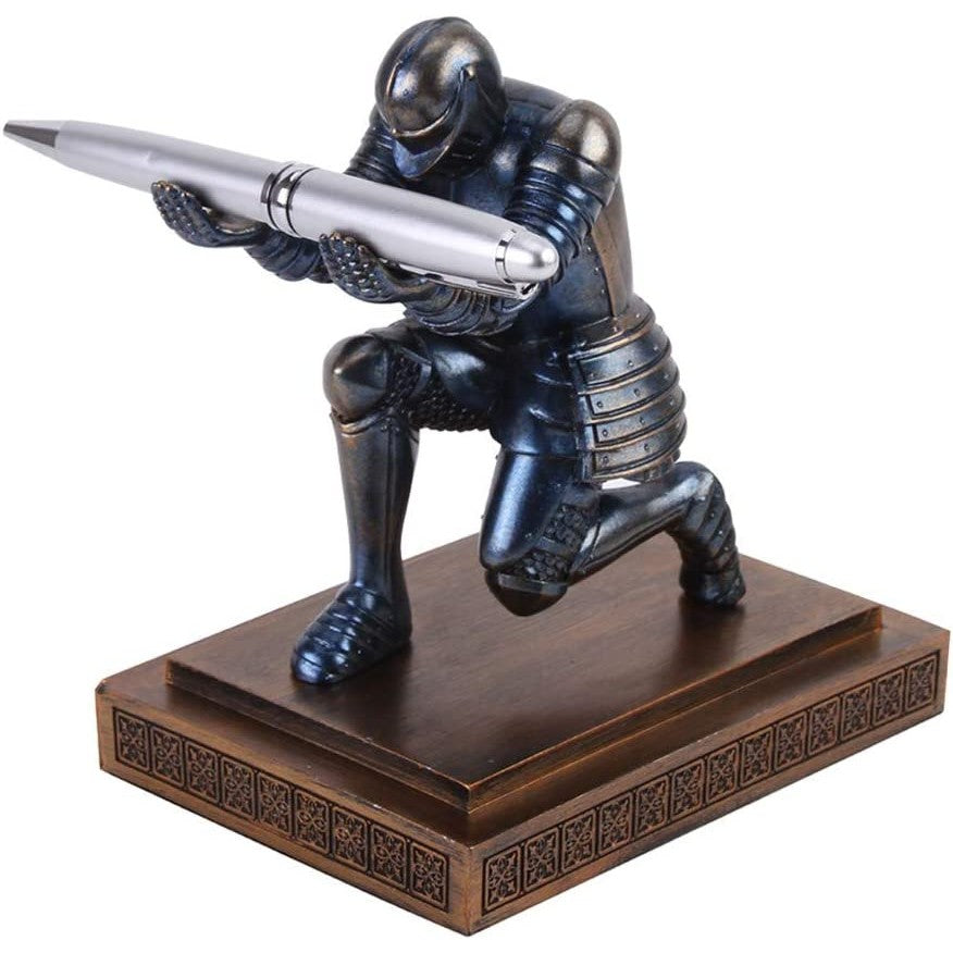 A pen holder featuring a knight bowing down offering up a pen.