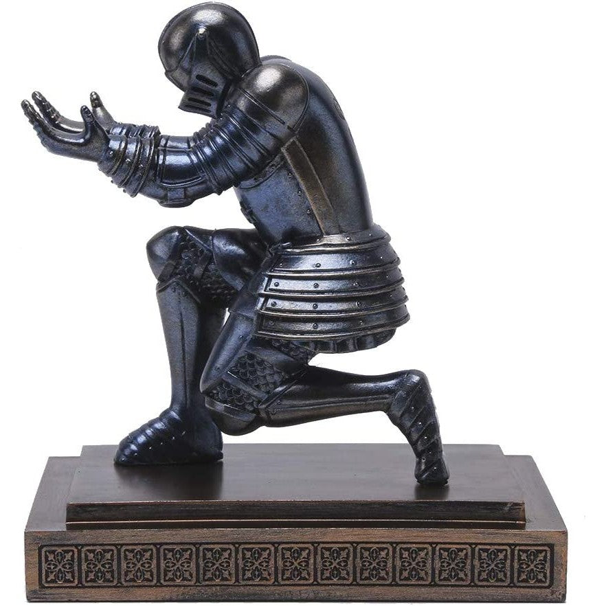 A pen holder which is shaped as a knight bowing down which can hold a pen.