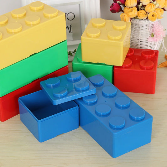 Giant sized versions of Lego pieces which are actually storage boxes. They are blue, red, yellow and green and are in various sizes.