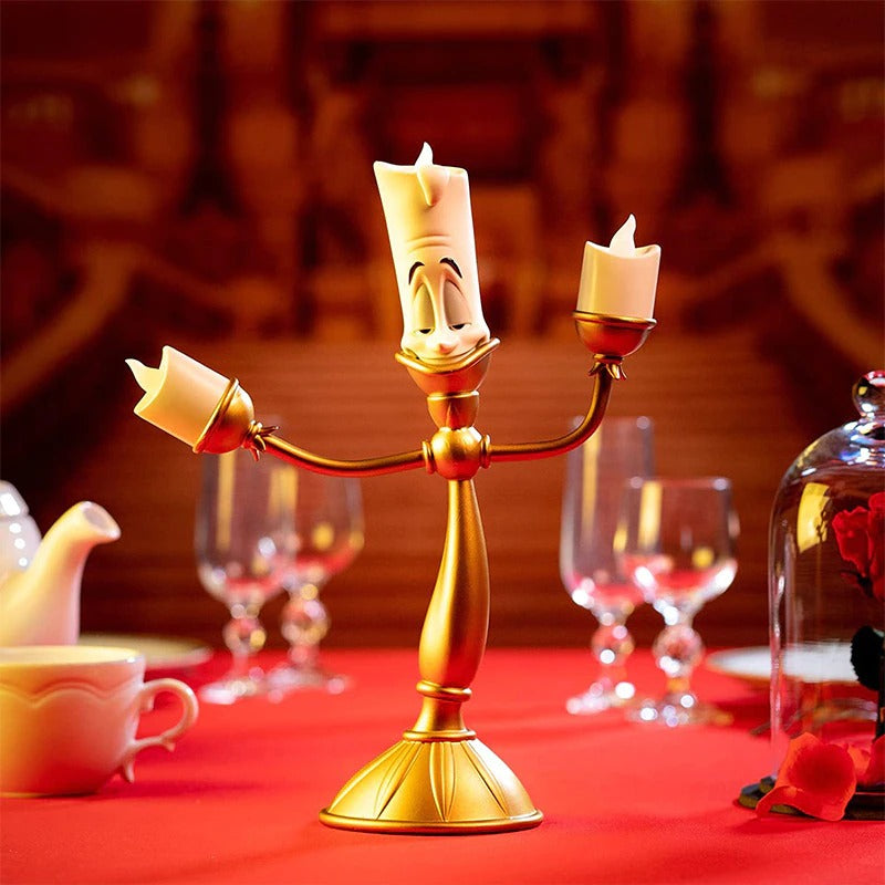 A candlestick which looks like Lumiere from the movie Beauty and the Beast. He is holding 3 LED candles, one in each hand and one of his head.