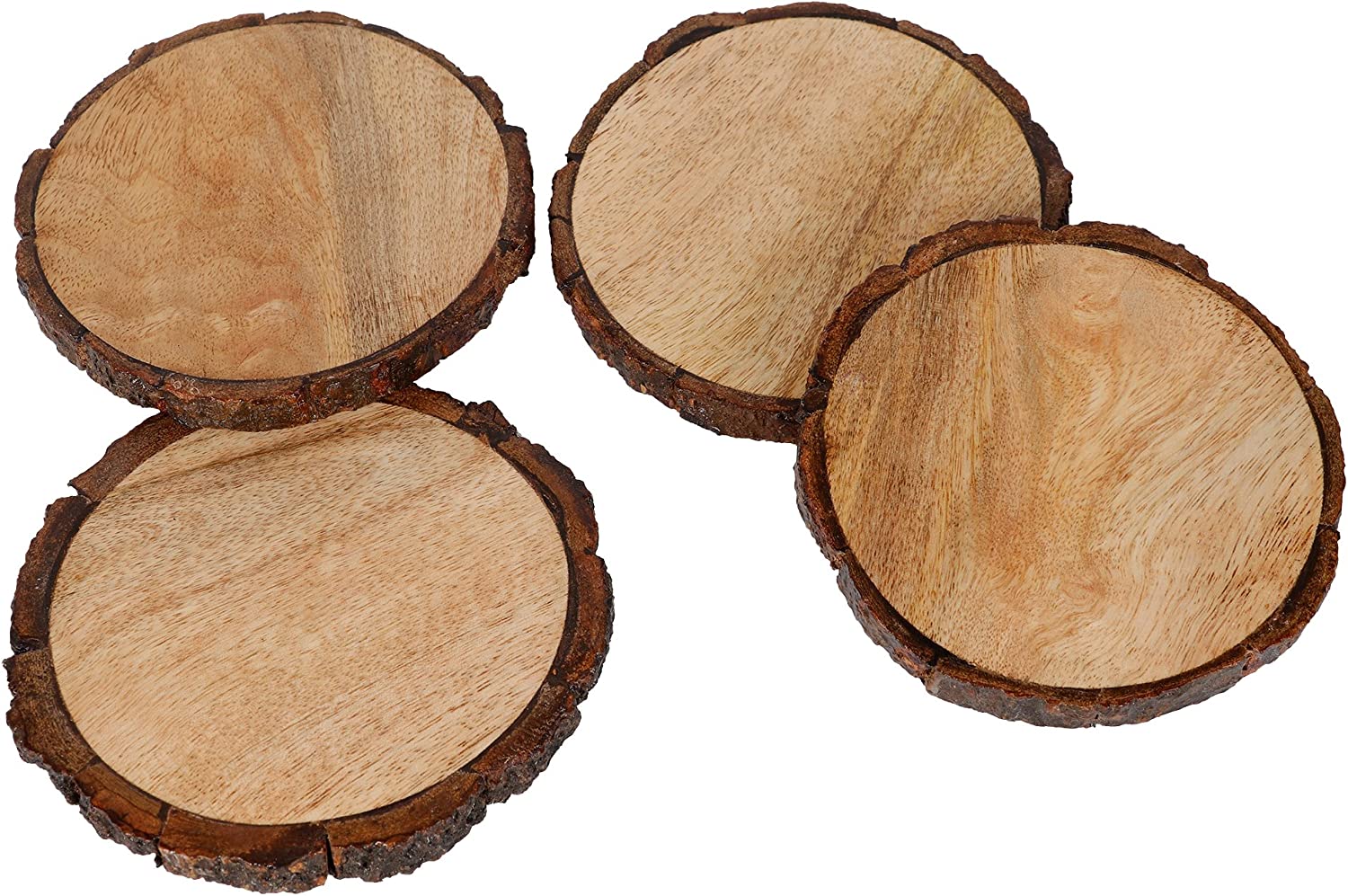 A close up view of 4 mango tree wooden coasters with bark edging.